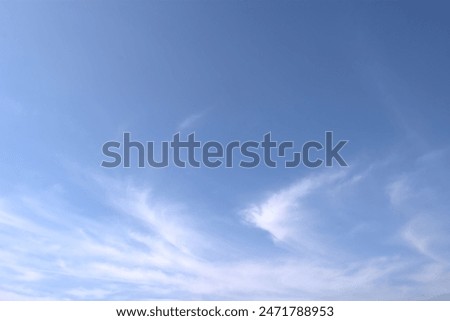 A refreshing background material of clouds like bird feathers in the sky blue sky.