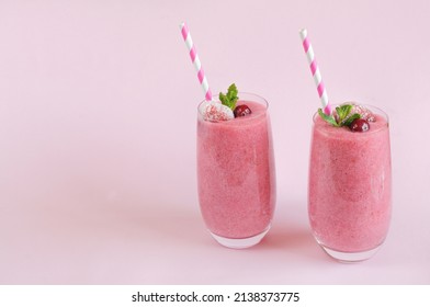 Refreshing berry smoothie with mint, two glasses. Daylight, front view. Selective focus with copy space - Shutterstock ID 2138373775