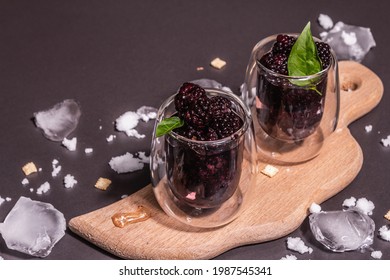 Refreshing Blackberry Fruit Drink. Cold Summer Berry Cocktail, Modern Hard Light, Dark Shadow. Black Stone Concrete Background, Copy Space