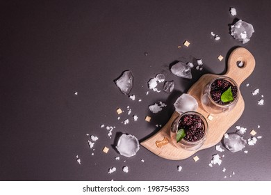 Refreshing Blackberry Fruit Drink. Cold Summer Berry Cocktail, Modern Hard Light, Dark Shadow. Black Stone Concrete Background, Top View