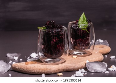 Refreshing Blackberry Fruit Drink. Cold Summer Berry Cocktail, Modern Hard Light, Dark Shadow. Black Stone Concrete Background, Copy Space