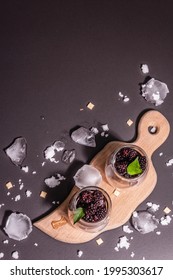 Refreshing Blackberry Fruit Drink. Cold Summer Berry Cocktail, Modern Hard Light, Dark Shadow. Black Stone Concrete Background, Top View