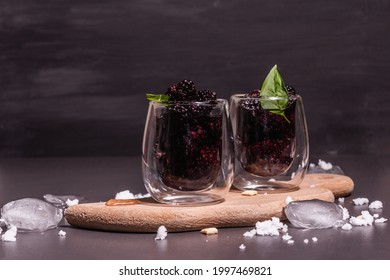 Refreshing Blackberry Fruit Drink. Cold Summer Berry Cocktail, Modern Hard Light, Dark Shadow. Black Stone Concrete Background, Copy Space