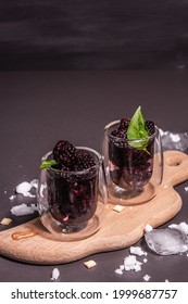 Refreshing Blackberry Fruit Drink. Cold Summer Berry Cocktail, Modern Hard Light, Dark Shadow. Black Stone Concrete Background, Copy Space