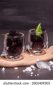 Refreshing Blackberry Fruit Drink. Cold Summer Berry Cocktail, Modern Hard Light, Dark Shadow. Black Stone Concrete Background, Copy Space