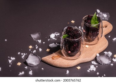 Refreshing Blackberry Fruit Drink. Cold Summer Berry Cocktail, Modern Hard Light, Dark Shadow. Black Stone Concrete Background, Copy Space