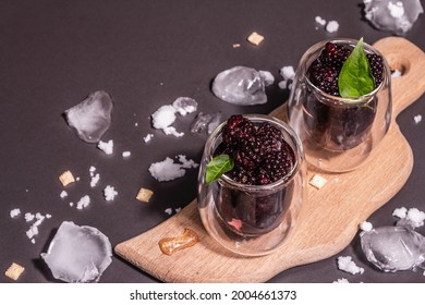 Refreshing Blackberry Fruit Drink. Cold Summer Berry Cocktail, Modern Hard Light, Dark Shadow. Black Stone Concrete Background, Copy Space