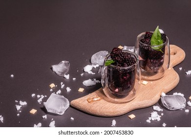 Refreshing Blackberry Fruit Drink. Cold Summer Berry Cocktail, Modern Hard Light, Dark Shadow. Black Stone Concrete Background, Copy Space