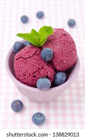 Refreshing Blueberry Sorbet In A Bowl And Fresh Blueberries