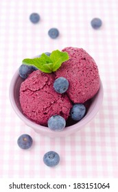 Refreshing Blueberry Sorbet In A Bowl And Fresh Blueberries, Top View