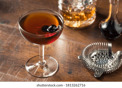Refreshing Boozy Manhattan Cocktail with Vermouth and Cherry Garnish - Shutterstock ID 1813262716