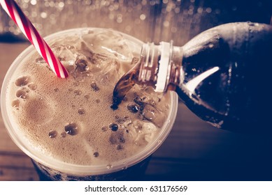 Refreshing Bubbly Soda Pop with Ice Cubes. Cold soda iced drink in a glasses - Selective focus, shallow DOF. - Shutterstock ID 631176569