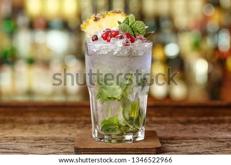 Refreshing cocktail with ice. Georgian Julep. Drinks with brandy, mint and cranberry.