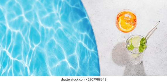 Refreshing cocktails by the pool on a sunny day, the perfect summer vacation. View from above with space for your text - Powered by Shutterstock