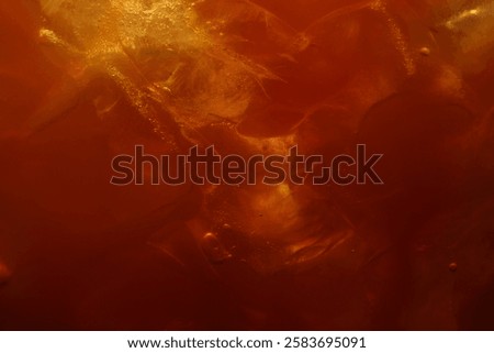 Refreshing coffee with ice cubes as background, closeup