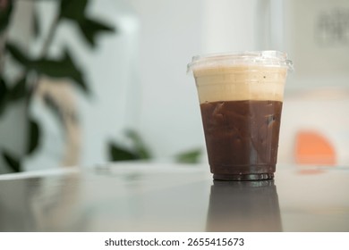 Refreshing cold brew coffee served in a plastic cup with ice