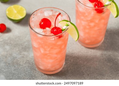 Refreshing Cold Cherry Limeade Soda with a Lime Garnish