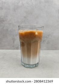 Refreshing cold coffee beverage with ice and milk layers, a delicious drink for enjoying and revitalizing