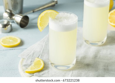 Refreshing Cold Egg Gin Fizz With A Lemon Garnish