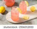 Refreshing Cold Iced Pink Lemonade Drink with Ice Cubes