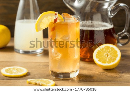 Refreshing Cold Lemonade and Iced Tea with a Lemon