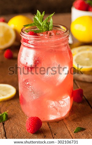 Refreshing Cold Raspberry Lemonade with a Mint Garnish