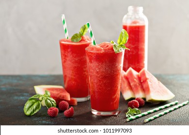 Refreshing cold summer drink watermelon slushie with basil