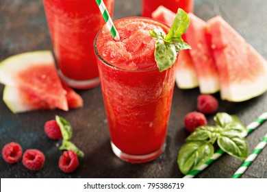 Refreshing cold summer drink watermelon slushie with basil