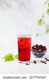 A Refreshing Drink Made Of Dried Hibiscus Leaves And Ice In A Glass.