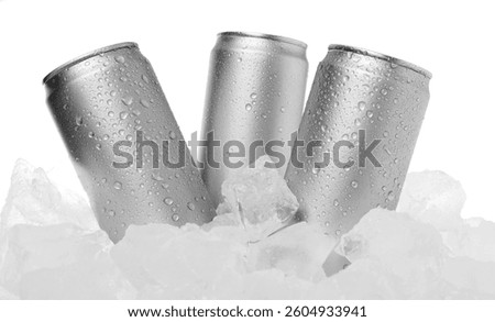 Refreshing drinks in cans on ice cubes against white background
