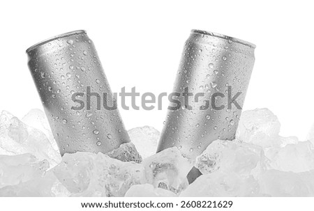 Refreshing drinks in cans on ice cubes against white background