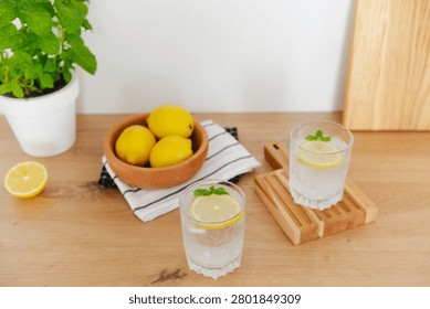 Refreshing drinks with lemon slices and mint leaves.