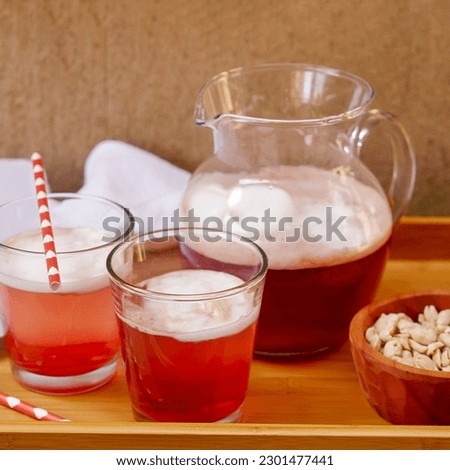 Refreshing earthquake recipe. Delicious terremoto typical of Chile's national holidays. Pipeño, grenadine and pineapple ice cream.
Sweet terremoto in a pitcher served in glasses.