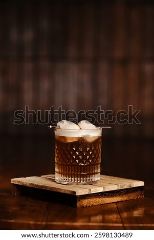 Refreshing ice lychee tea with sweet lychee fruit, chilled tea, and ice cubes in a glass. A perfect summer drink with a tropical twist.


