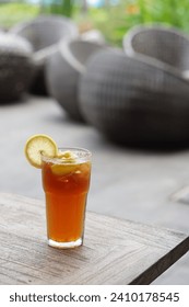 Refreshing iced lemon tea – a harmonious blend of brisk black tea, ice cubes, and a burst of citrusy freshness from zesty lemon slices