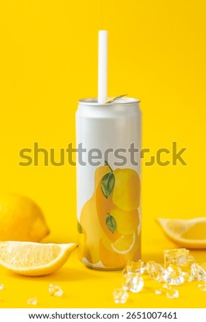Refreshing Lemon Drink Can Mockup with Ice on Bright Yellow Background