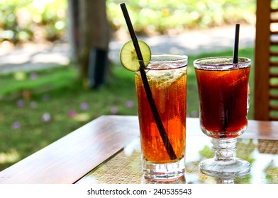 Refreshing Lemon Iced Tea And Black Tea In The Garden