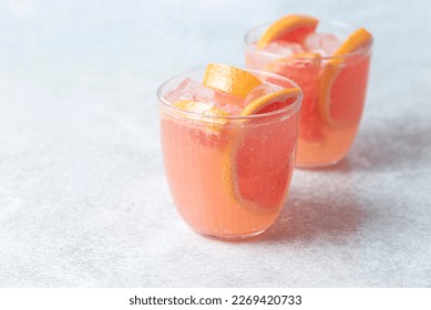 Refreshing low alcohol cocktail with grapefruit on a fresh stone background. Fruity light cocktails,  eco friendly  natural style, soft pastel colors, copy space  - Shutterstock ID 2269420733