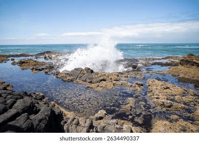 Refreshing Ocean Waves Splash on Coastal Rocks
