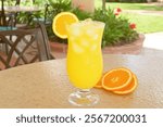 Refreshing Orange Juice Cocktail on a Sunny Patio