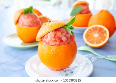 Refreshing orange sorbet served in a fresh blood orange
