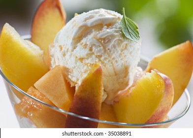 Refreshing peach ice cream in a glass close up