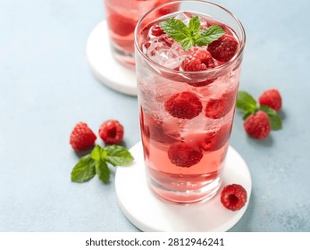 Refreshing raspberry drink with mint and ice