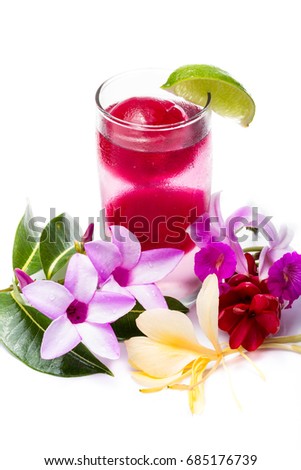 refreshing sparkling cocktail with frozen red juice garnished with beautiful wildflowers isolated on a white background
