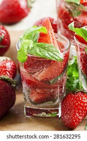 Refreshing strawberry drink with mint, selective focus