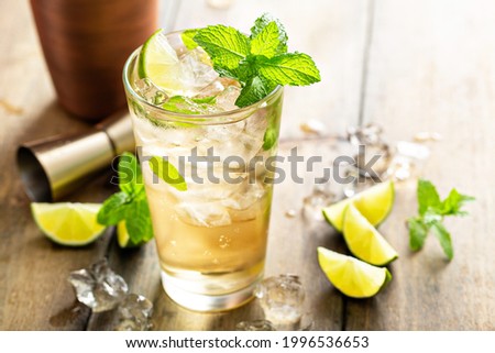 Refreshing summer cocktail with ginger beer, rum and lime