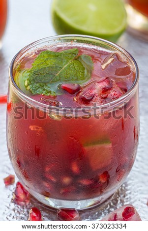 Refreshing summer cocktail - pomegranate with ginger ale and ice