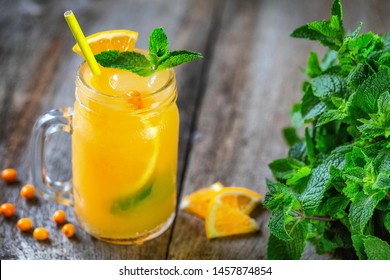 Refreshing summer drink of sea buckthorn, orange and mint. Lemonade. Mors