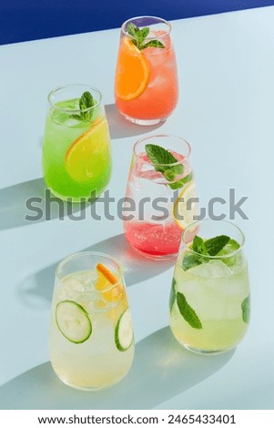 Refreshing Summer Lemonade Composition with Citrus and Mint on Vibrant Background.