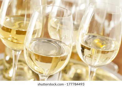 Refreshing White Wine in a Glass on a Background